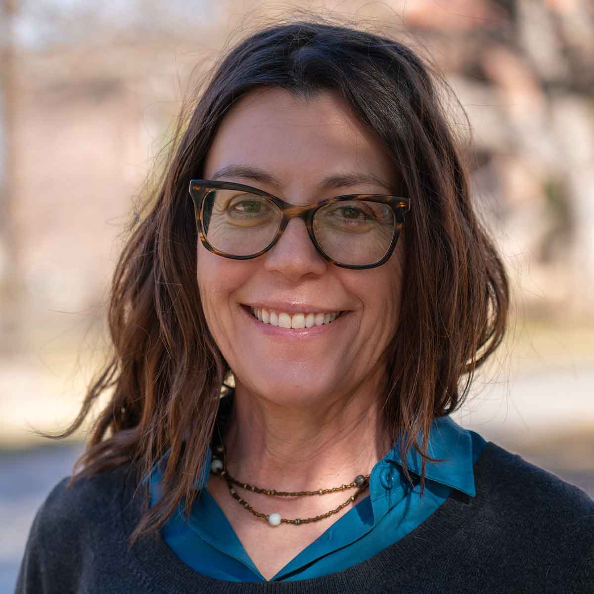 Headshot of Jesse Kelsch, Ph.D. standing outdoors.